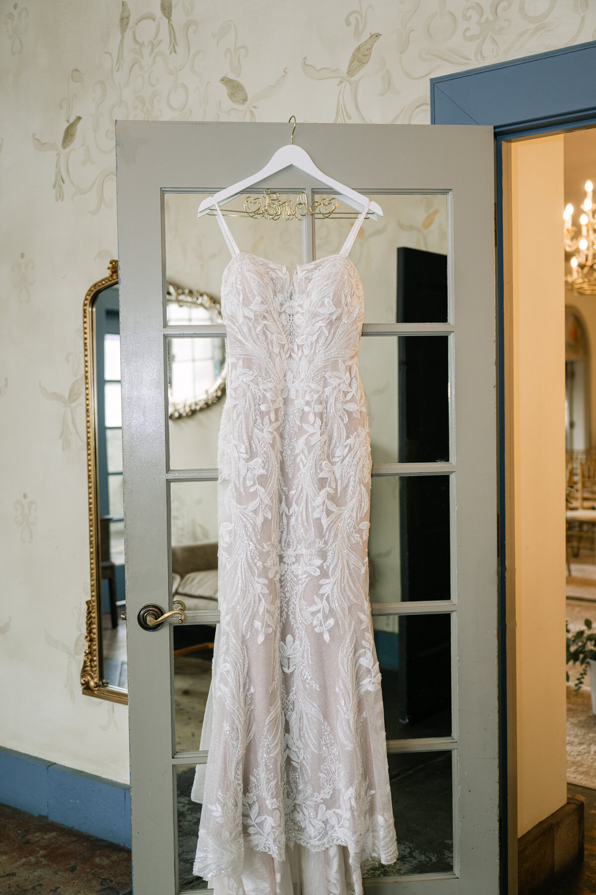 wedding dress hanging on door bridal suite seattle venue