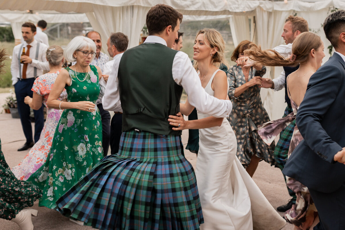 Ceilidh dancing at Devon marquee wedding