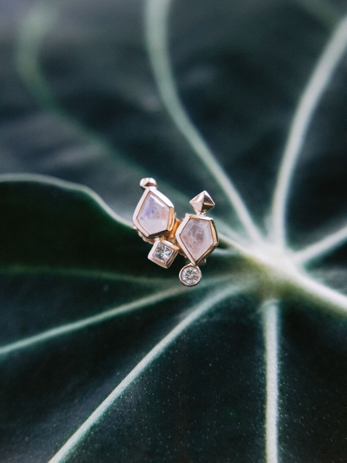 Pentagon-shaped earrings with diamonds in Montage at Palmetto Bluff. Destination wedding image by Jenny Fu Studio