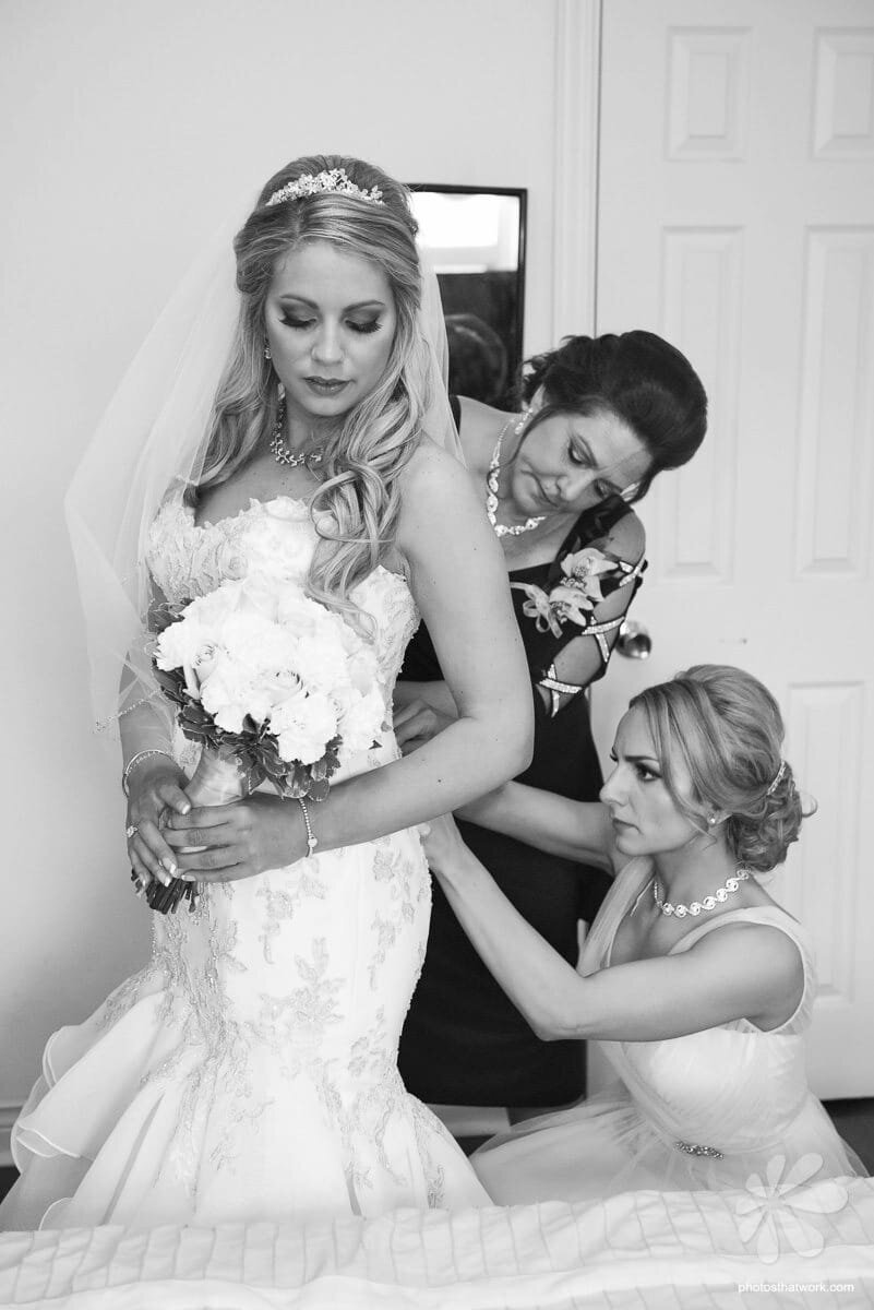 Bride Getting Ready with Two Helpers
