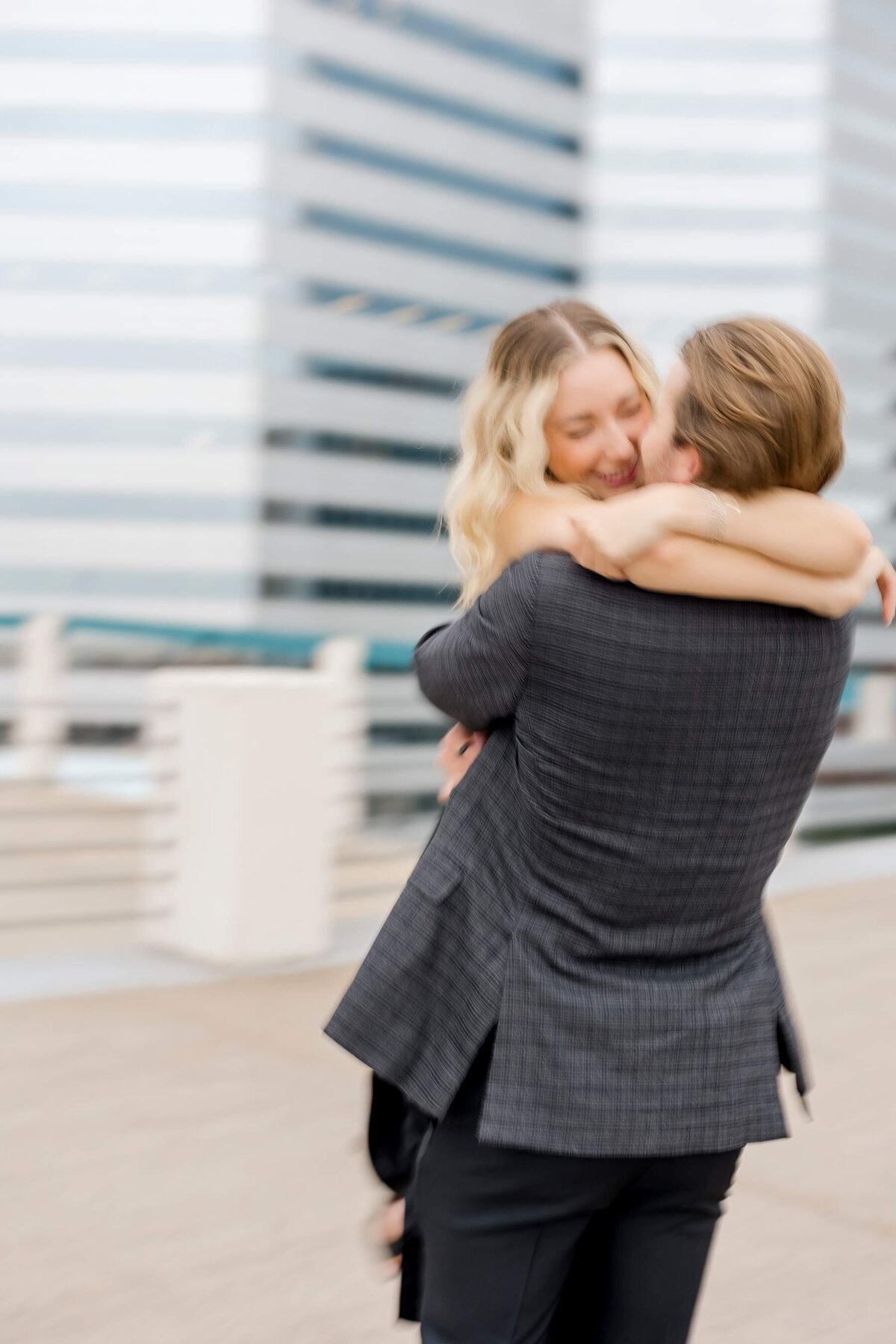 Couple plays together in Downtown Minneapolis during their engagement session