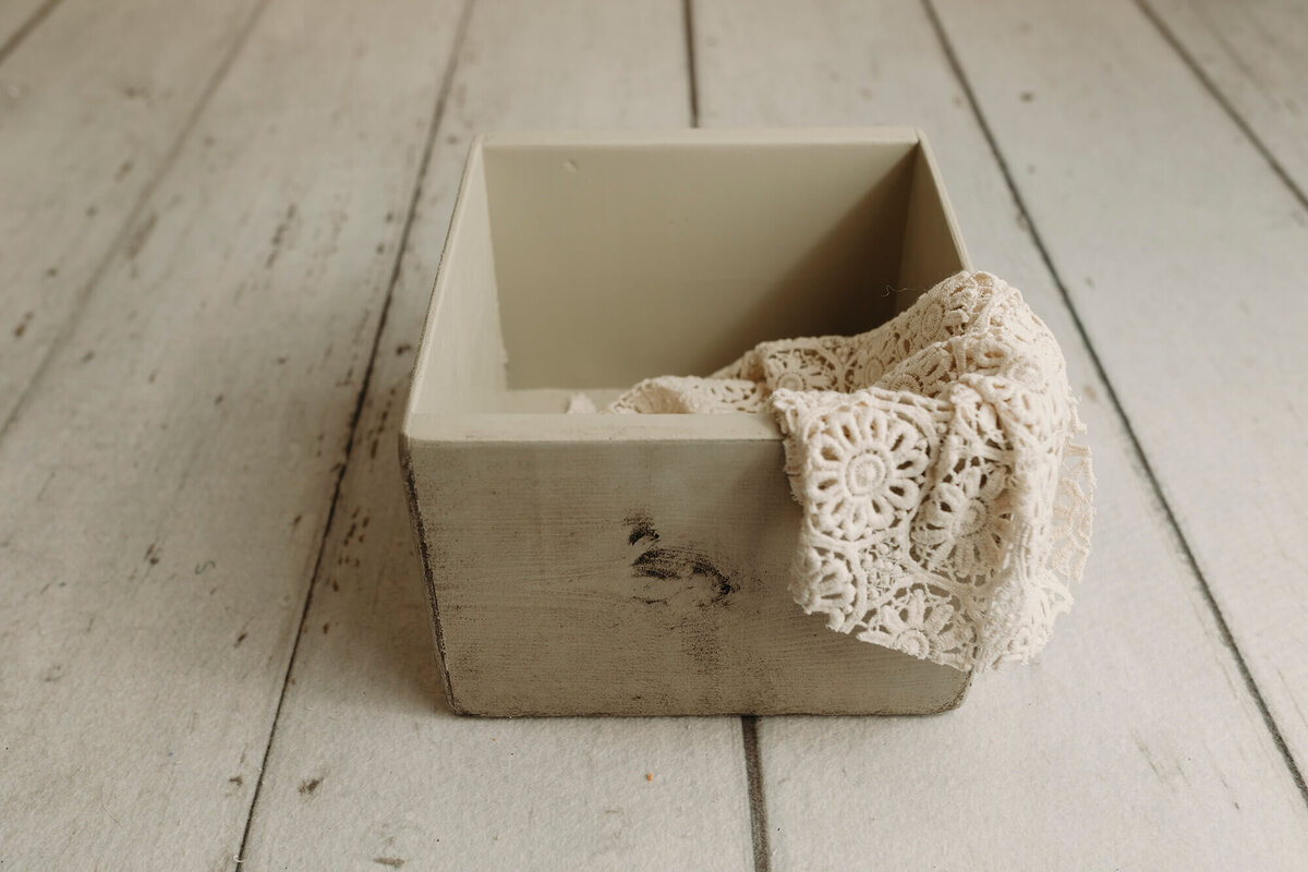 Wooden distressed crate used for newborn photography sessions.