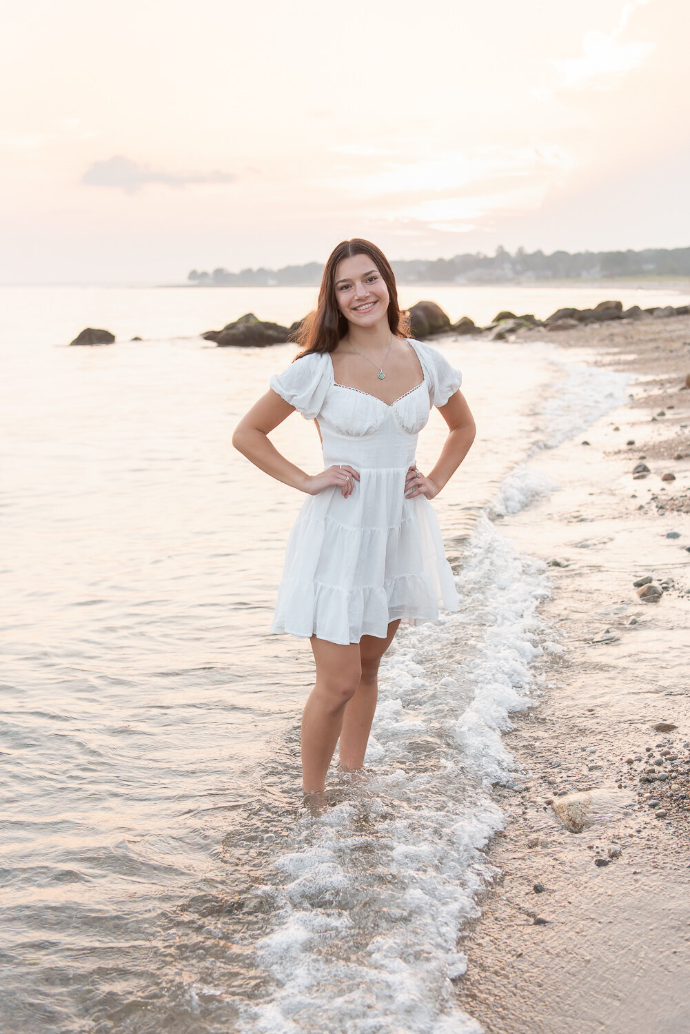 Girl in white dress standing in ocean for senior photo shoot |Sharon Leger Photography | Canton, CT Newborn & Family Photographer