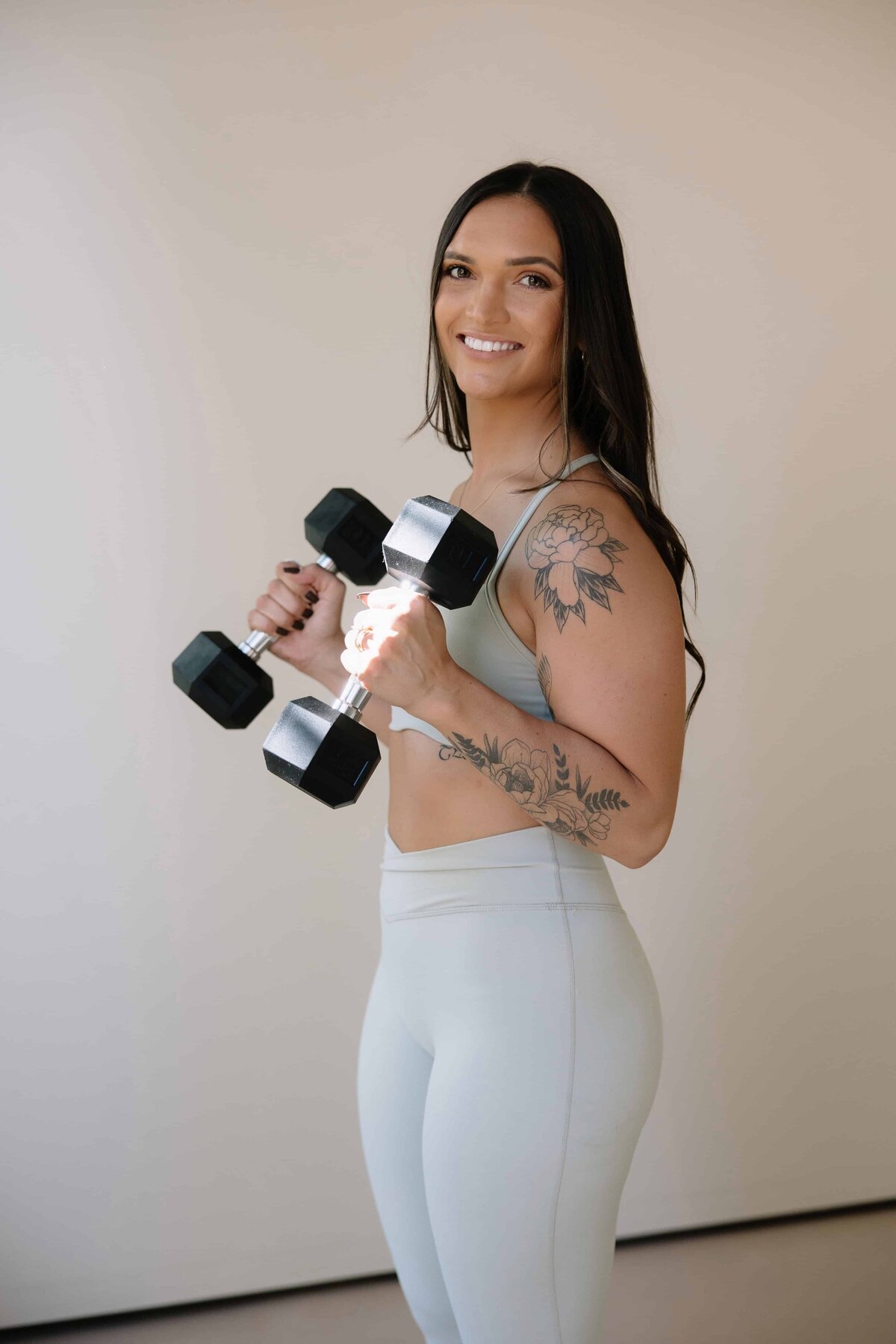 A fitness coach does exercises during her personal branding session in Loveland, Colorado.