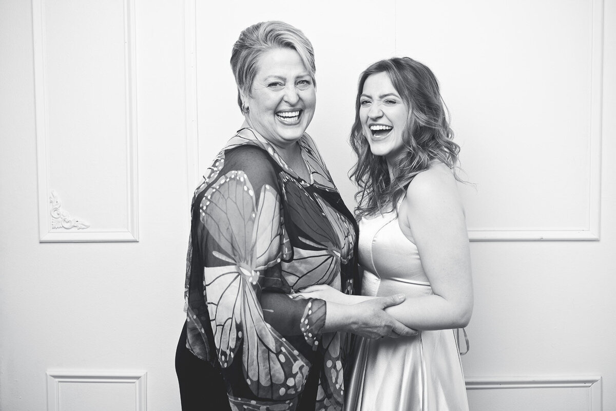 Joyful Mother and Daughter Embracing in Black and White Family Portrait-18