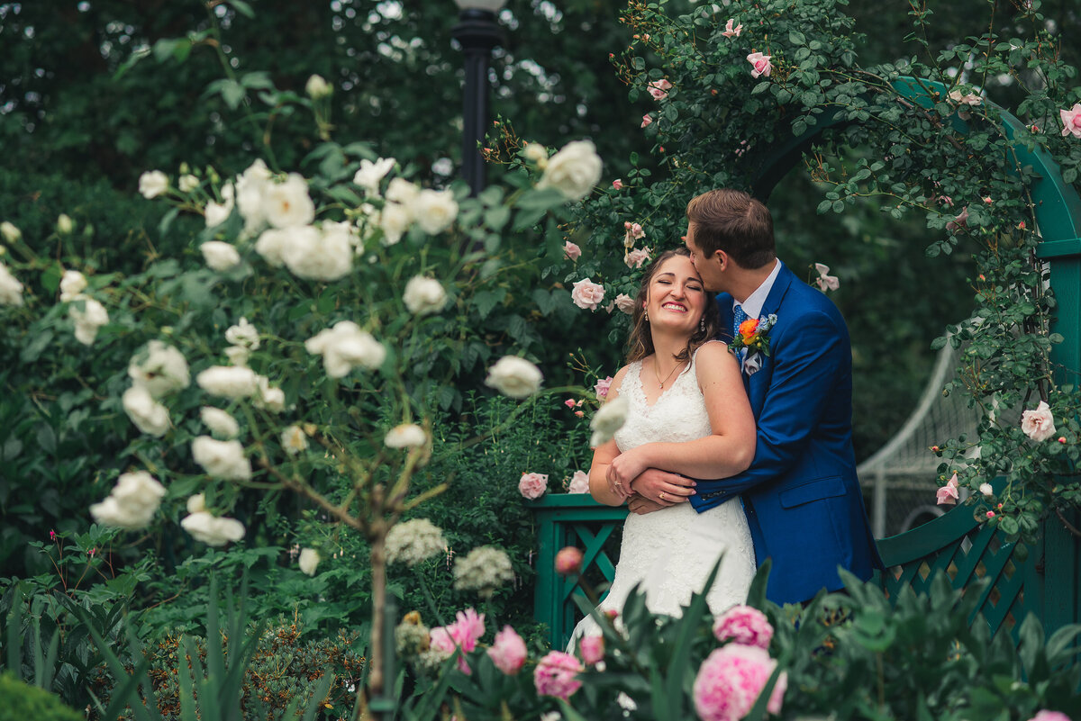 rose garden with bride & groom