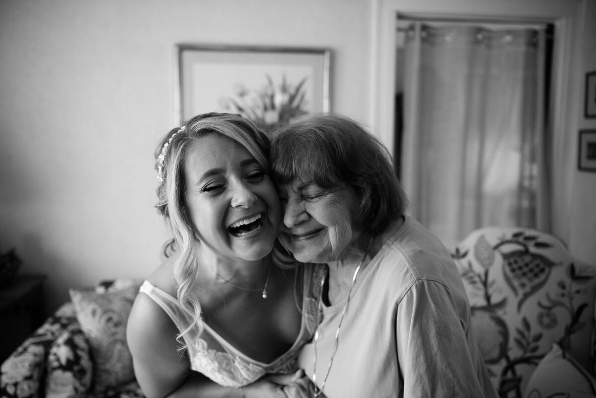 bride shares hug with grandma at her ct wedding photo by cait fletcher photography