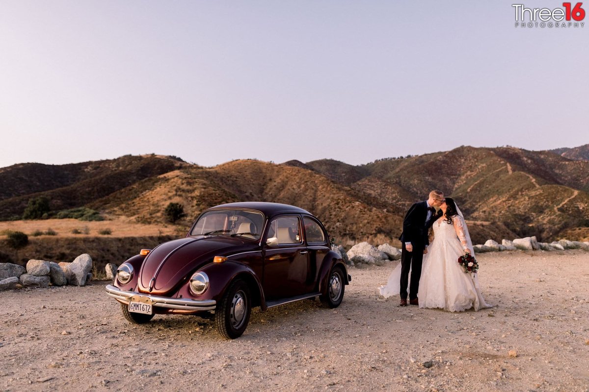 Bride and Groom share a kiss during their photo session