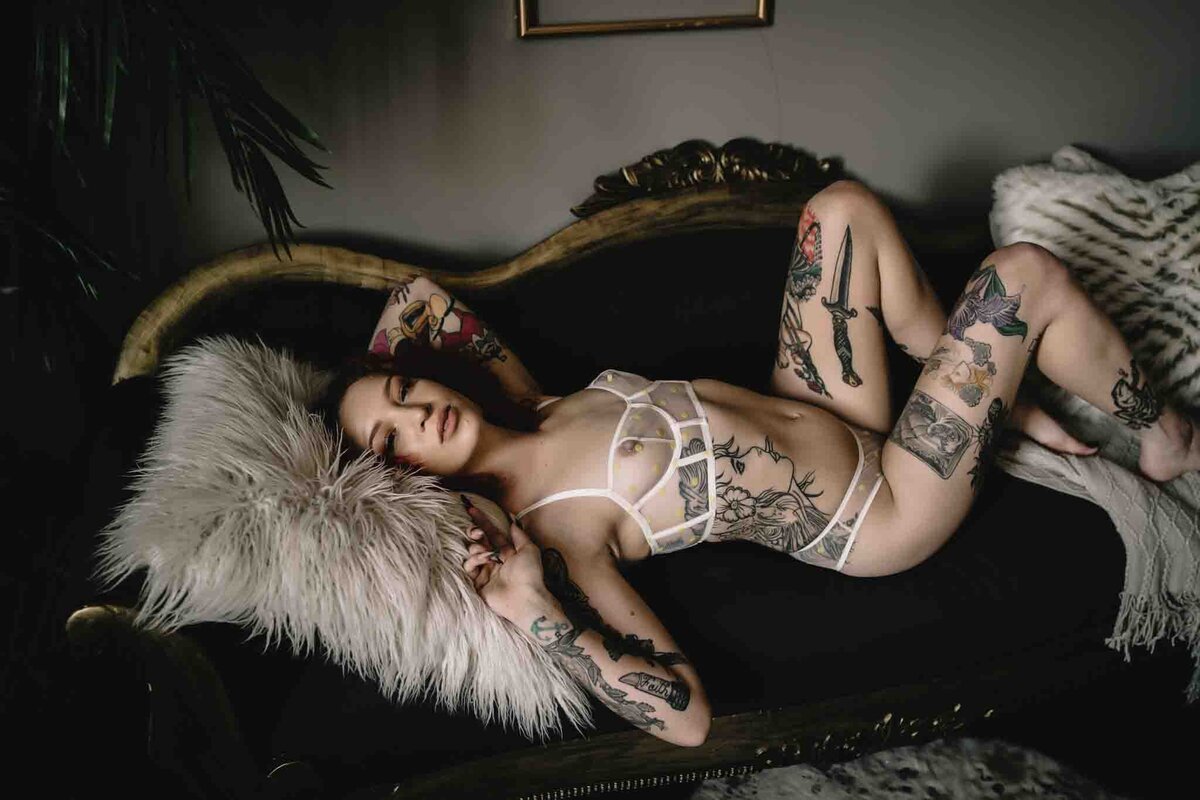 tattoed-Women-laying-on-boudoir-in-lingerie