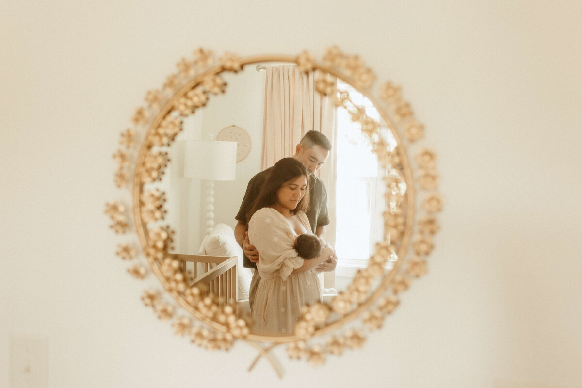 Newborn lying on bed during Franklin Tennessee in-home photo session