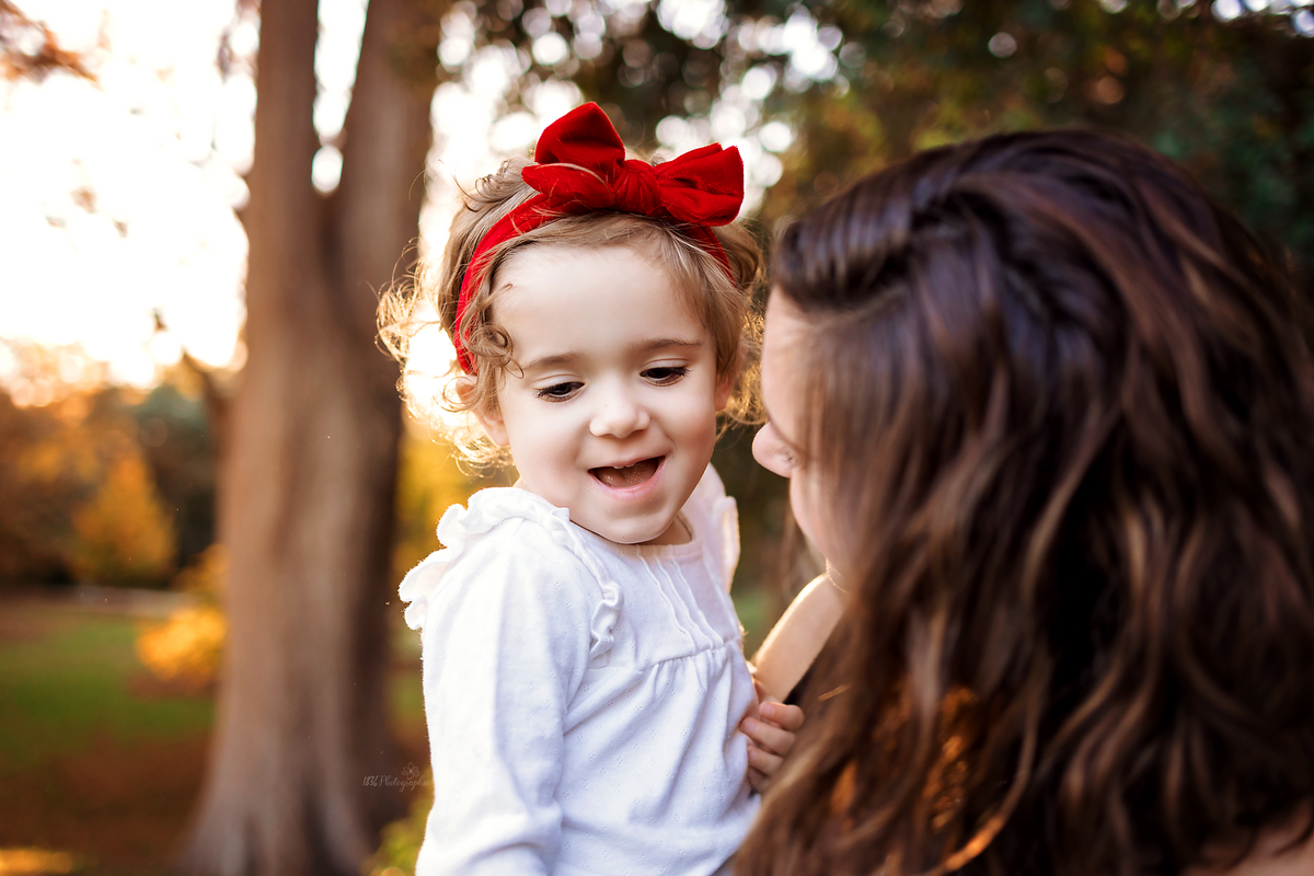 Discover double joy in a family session with twins at Landa Park, New Braunfels. This laid-back experience captures candid moments, providing young parents with memorable and stress-free memories