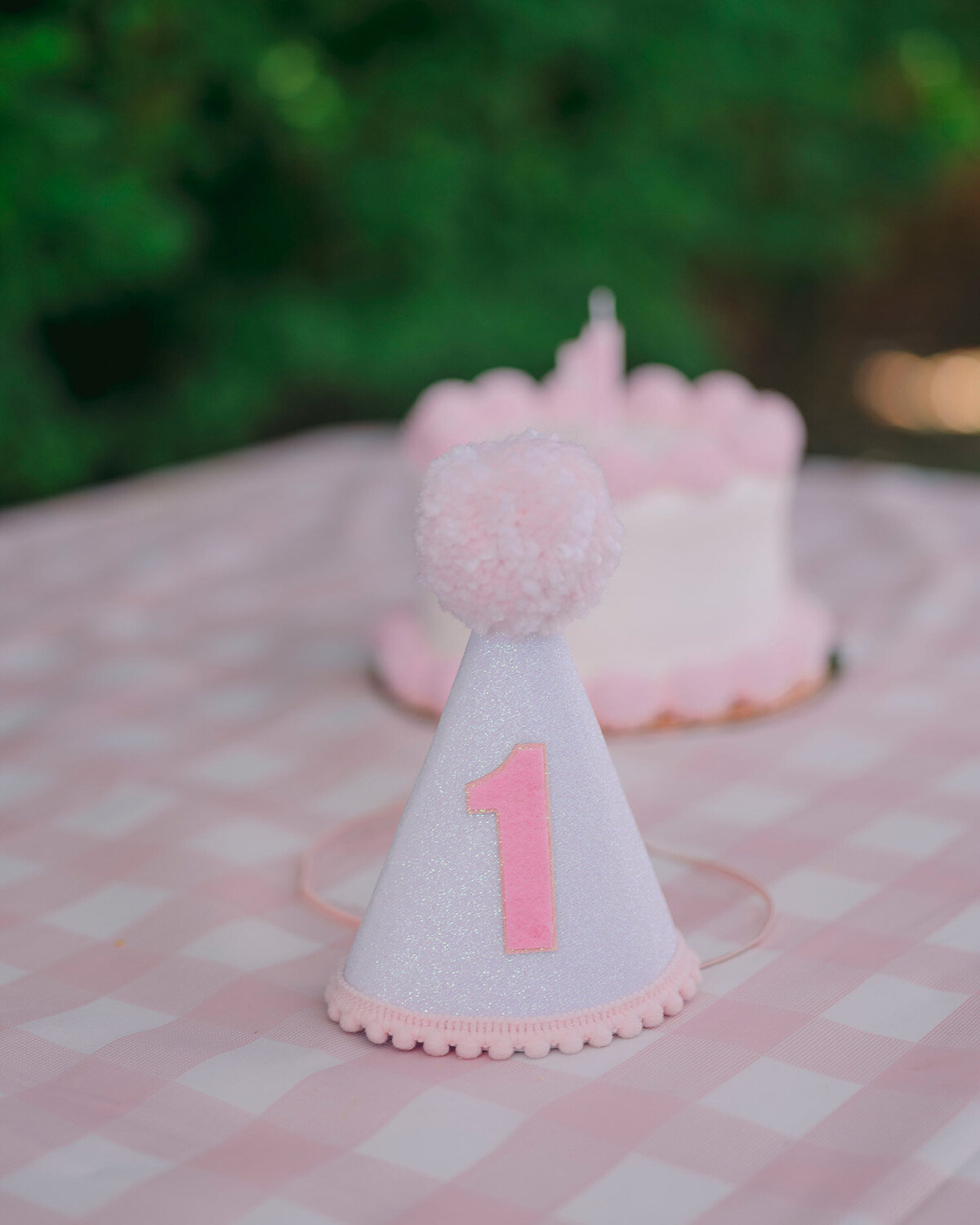Pink party hat detail at a first birthday party in the San Francisco Bay Area.
