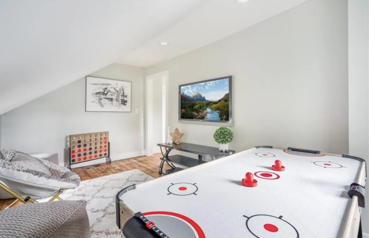game room with shuffle board table