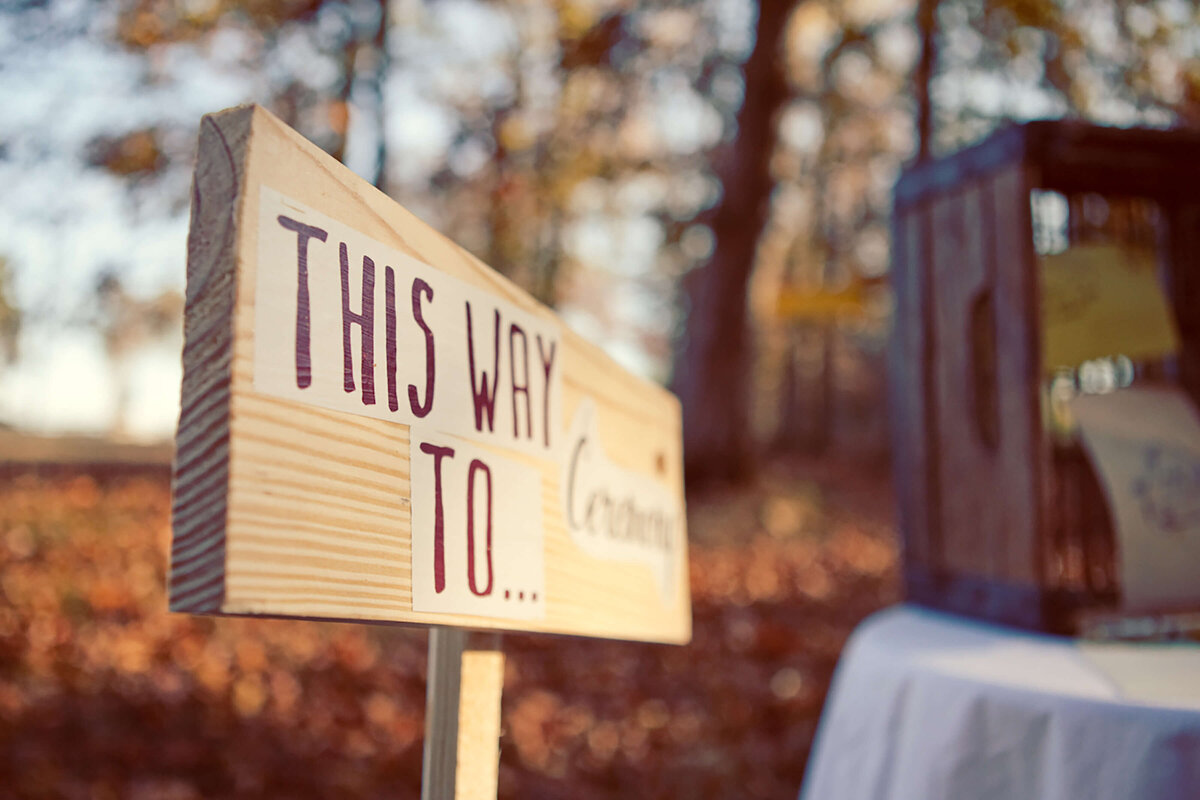 whimsical-cabin-wooden-signage-wedding-ampersandink