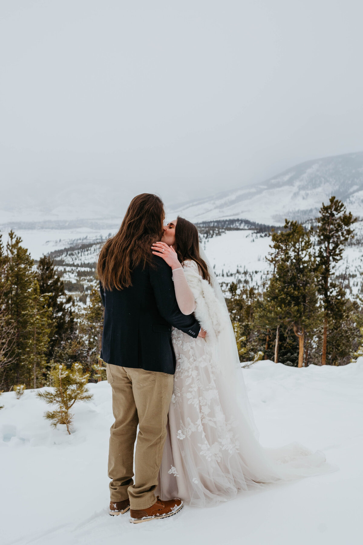 bride-and-groom-kissing-on-mountain-top