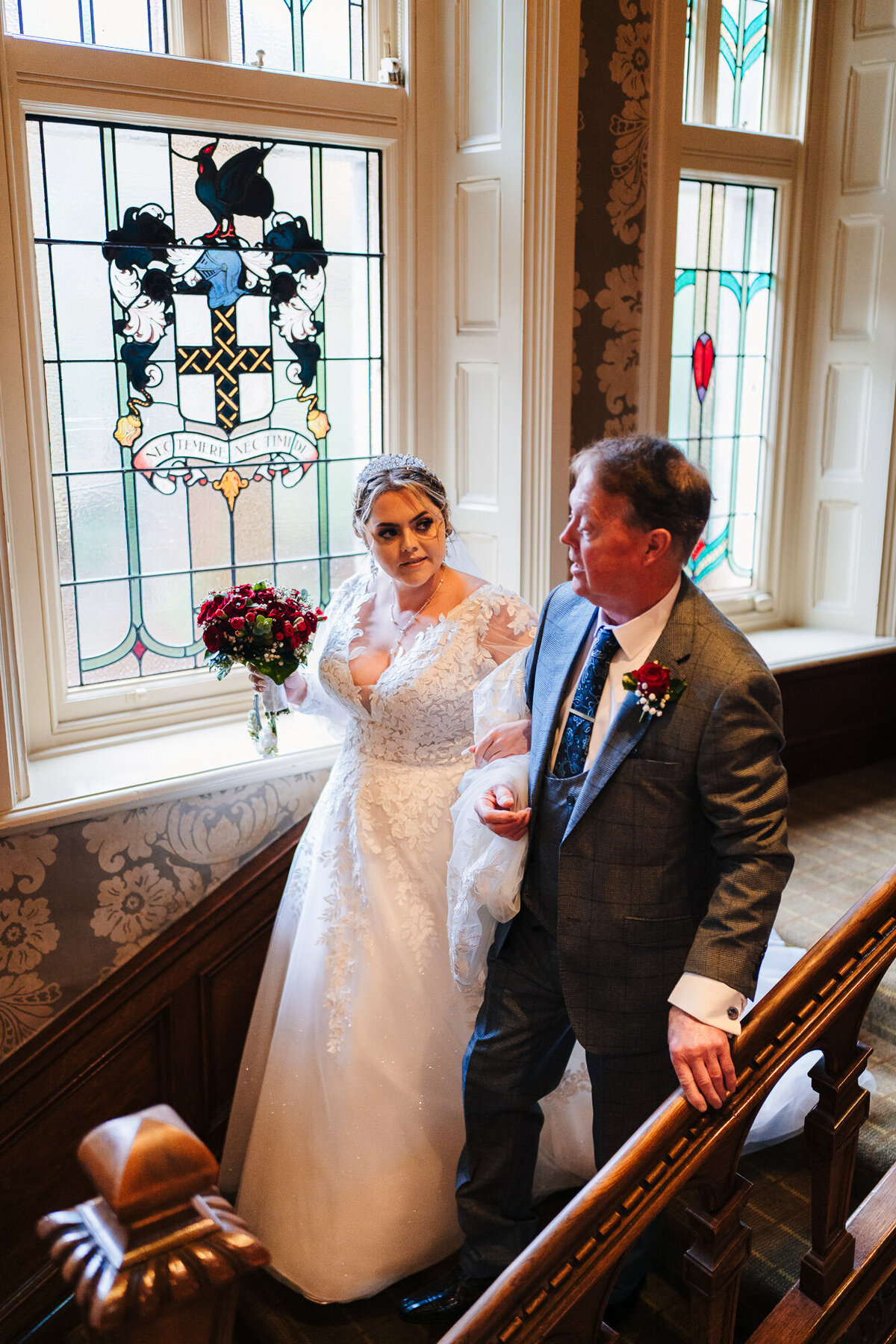Bride and father walking down the stairs at Merewood Country House Hotel
