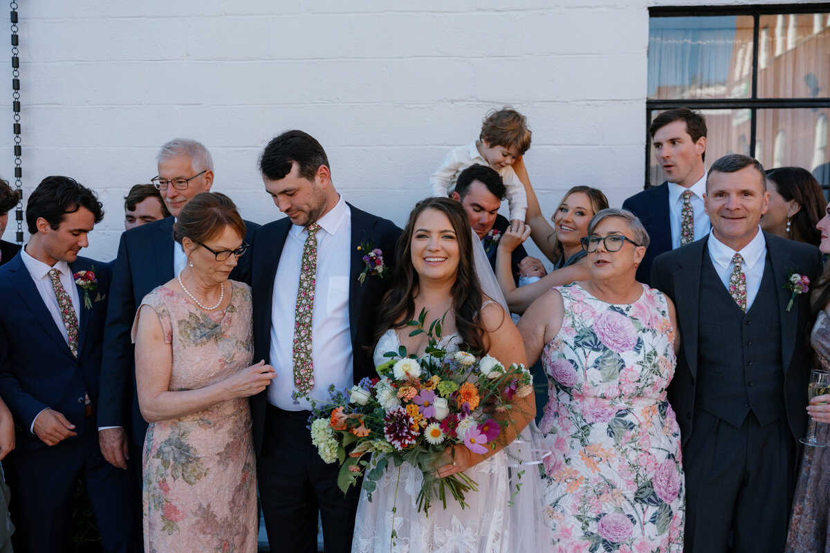 Newlywed smiling with their family