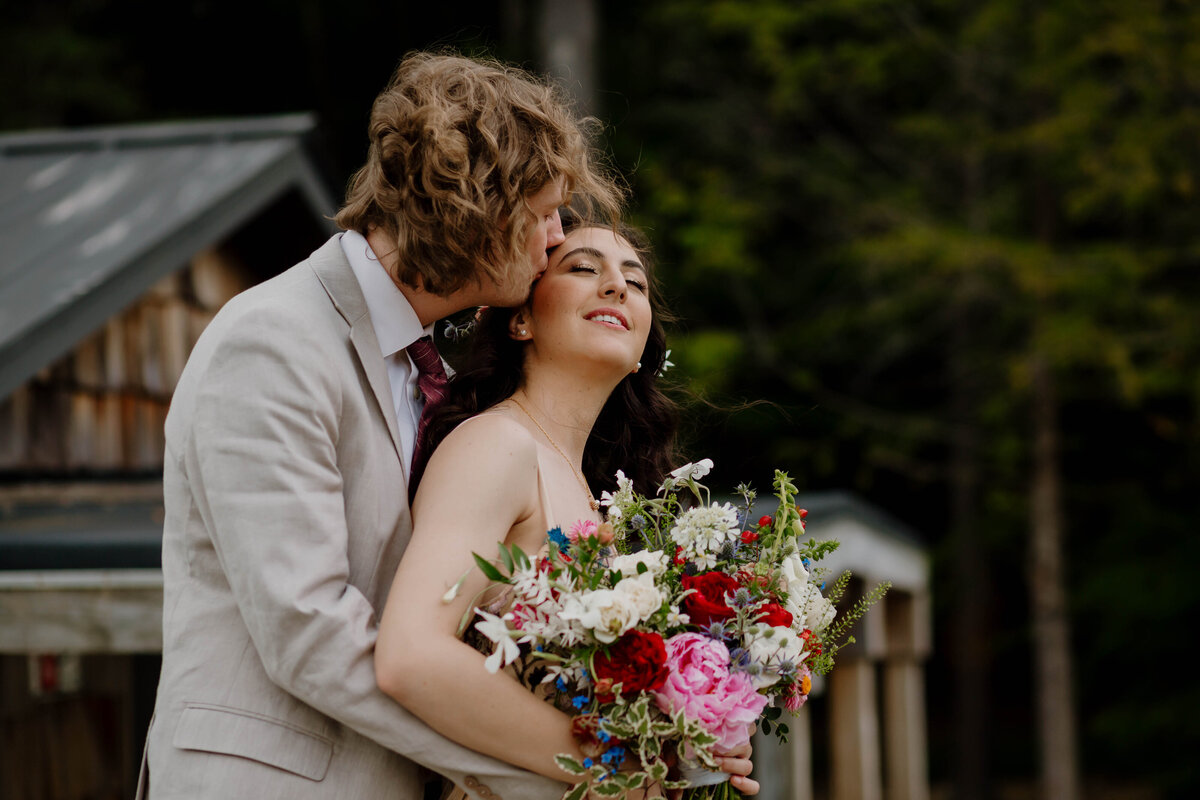 Upstate NY Wedding Photographer, Couple on bridge at The Rosemary at Spano Lake