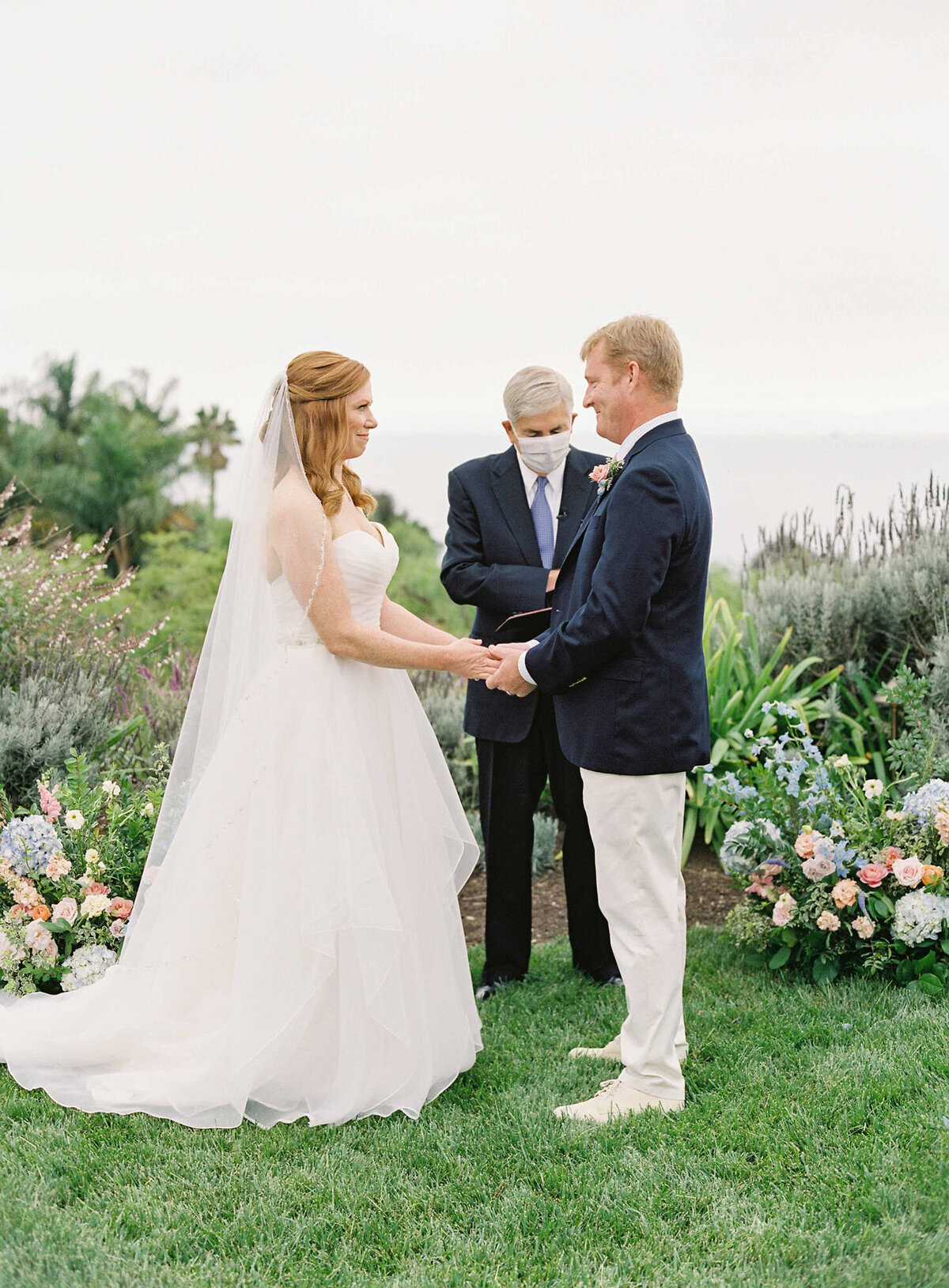 16santa-barbara-estate-wedding-planner-wedding-vows-ocean-front-officiant-ceremony-flowers-blue-hydrangea