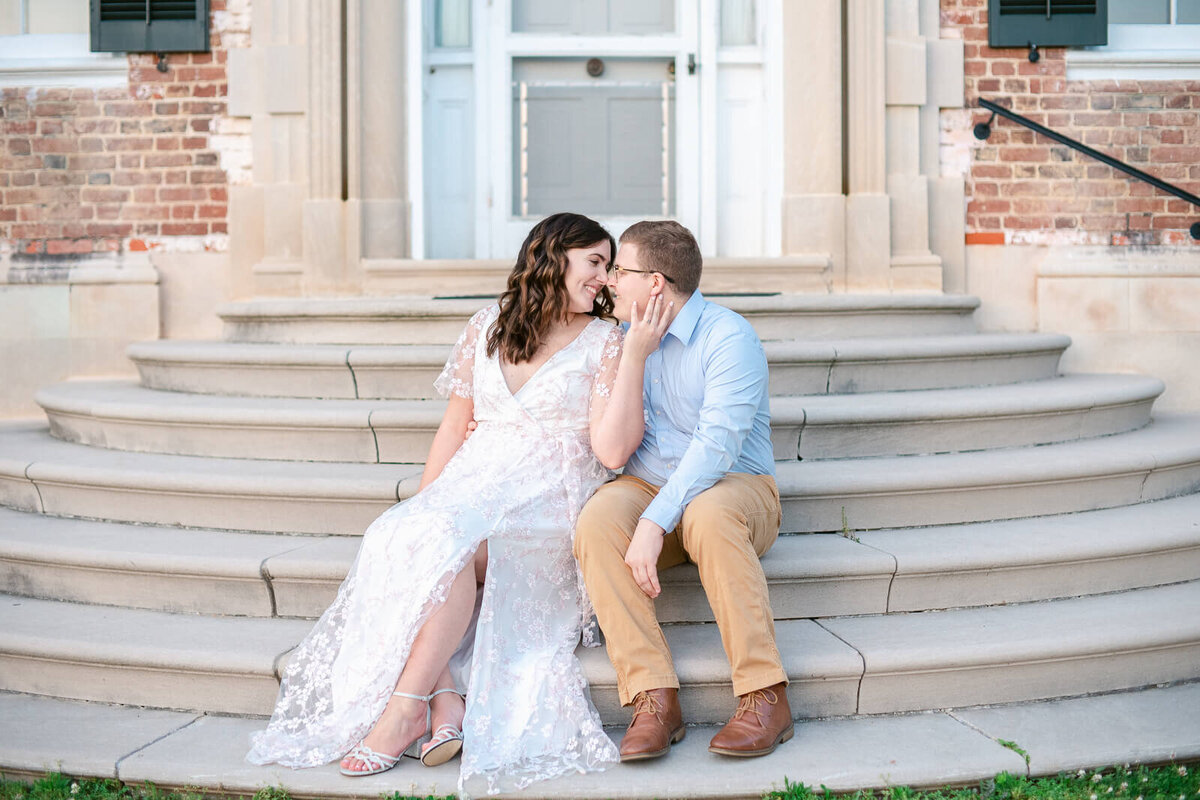 Couple taking engagement photos at Chatham Manor in Fredericksburg, Virginia. Captured by Bethany Aubre Photography.