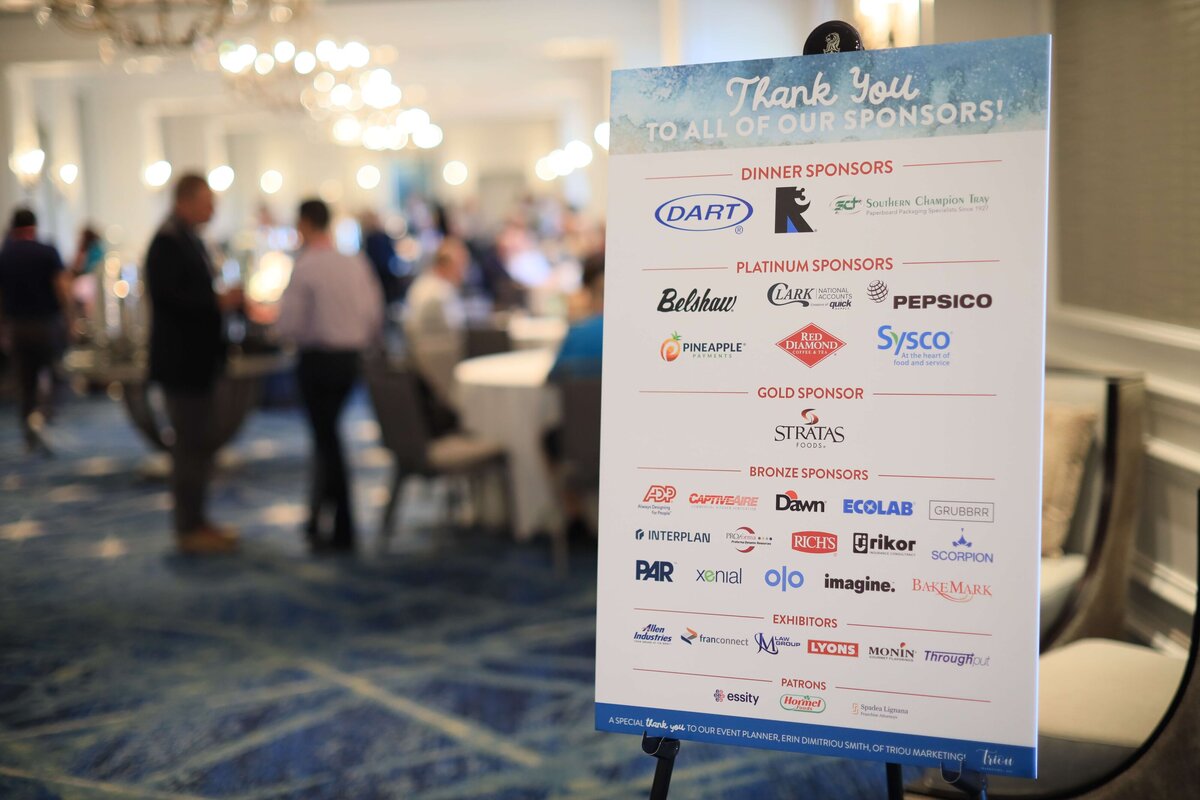 sign at the entrance of a corporate event