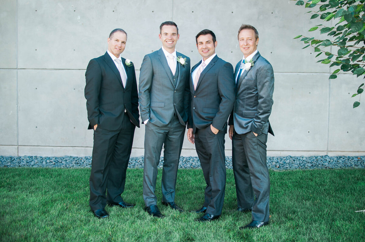 groomsmen in grey suits standing together outside ponzi winery