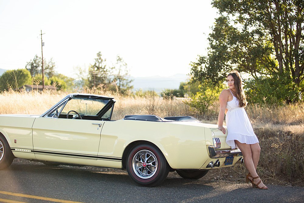 Yellow convertible vintage car with senior girl