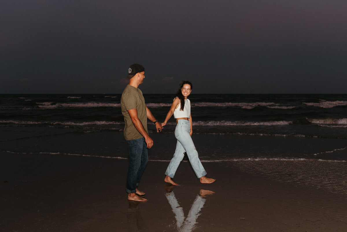 couple walking on the beach on padre island