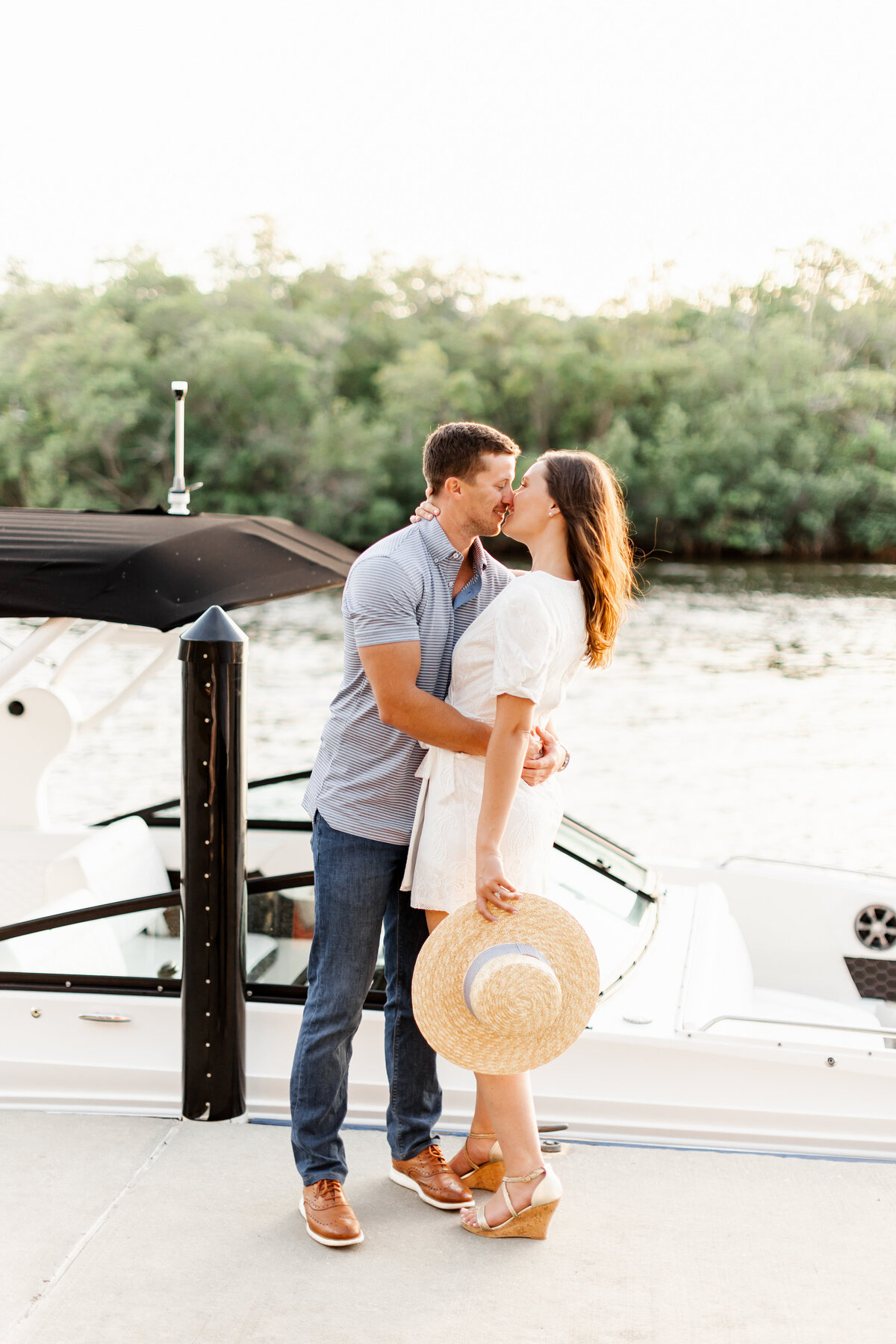 engaged couple on a dock taken by wedding photographer in fort lauderdale