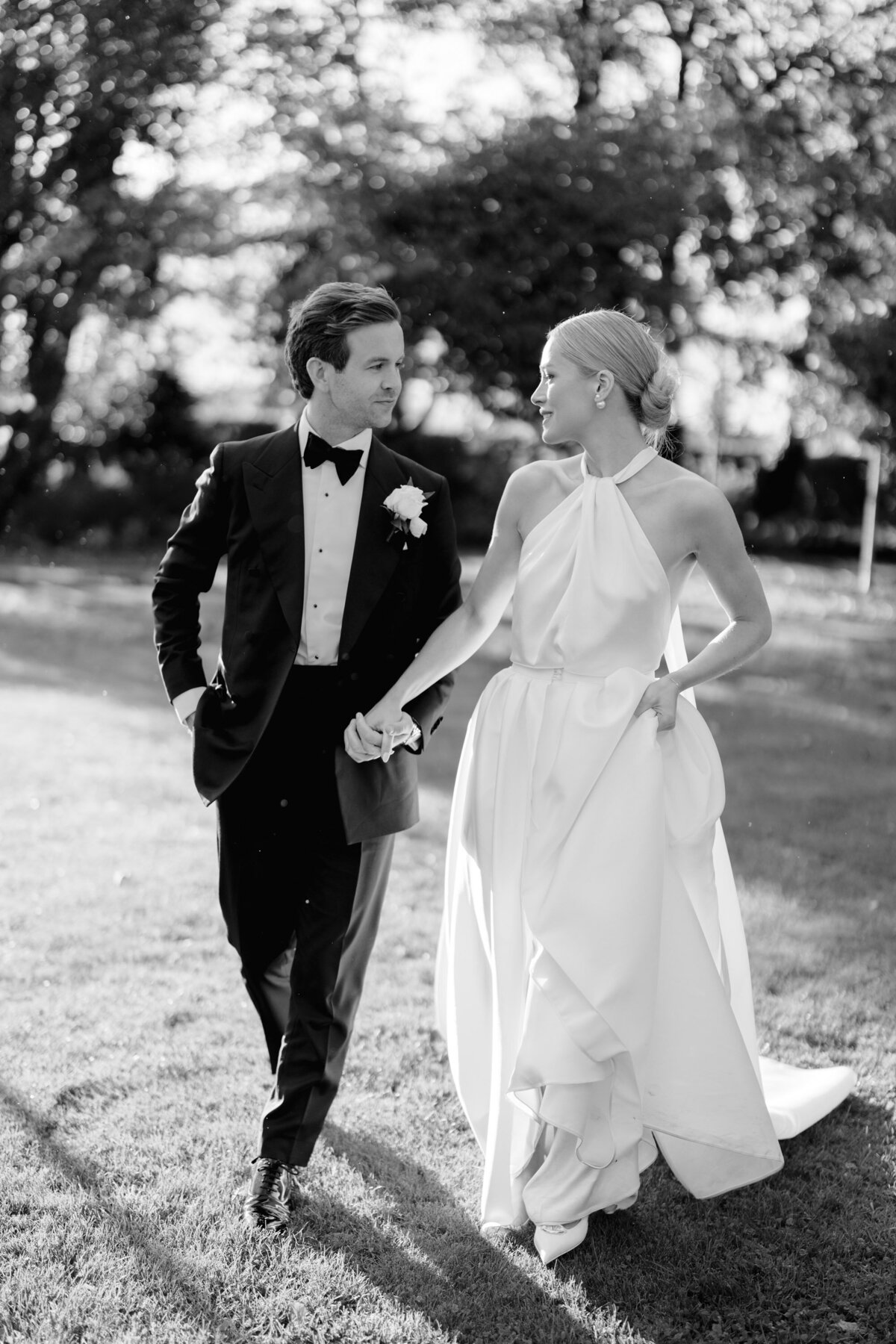 couple walking elegant black and white photo