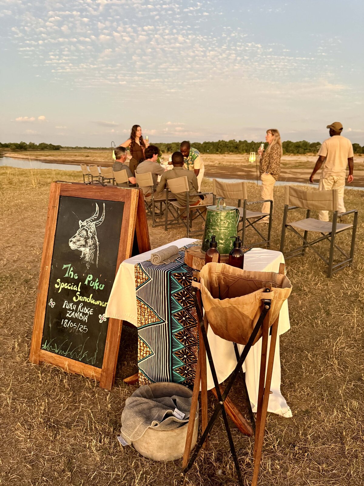 People watching the sunrise in lawn chairs