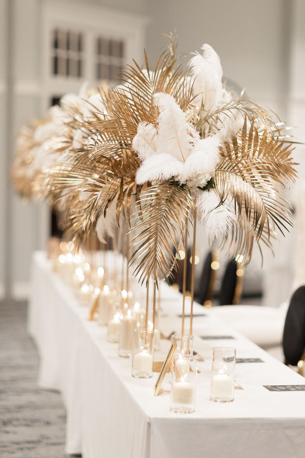 Gold and white Gatsby head table centerpiece at Sweet 16 at Park Avenue Club in Florham Park, NJ