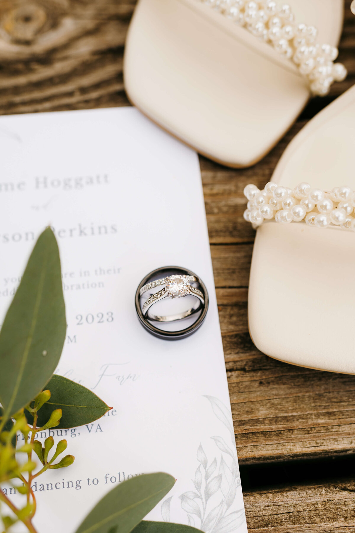 Shenandoah National Park wedding photos of a detail shot of the brides wedding ring on an invitation next to bride shoes