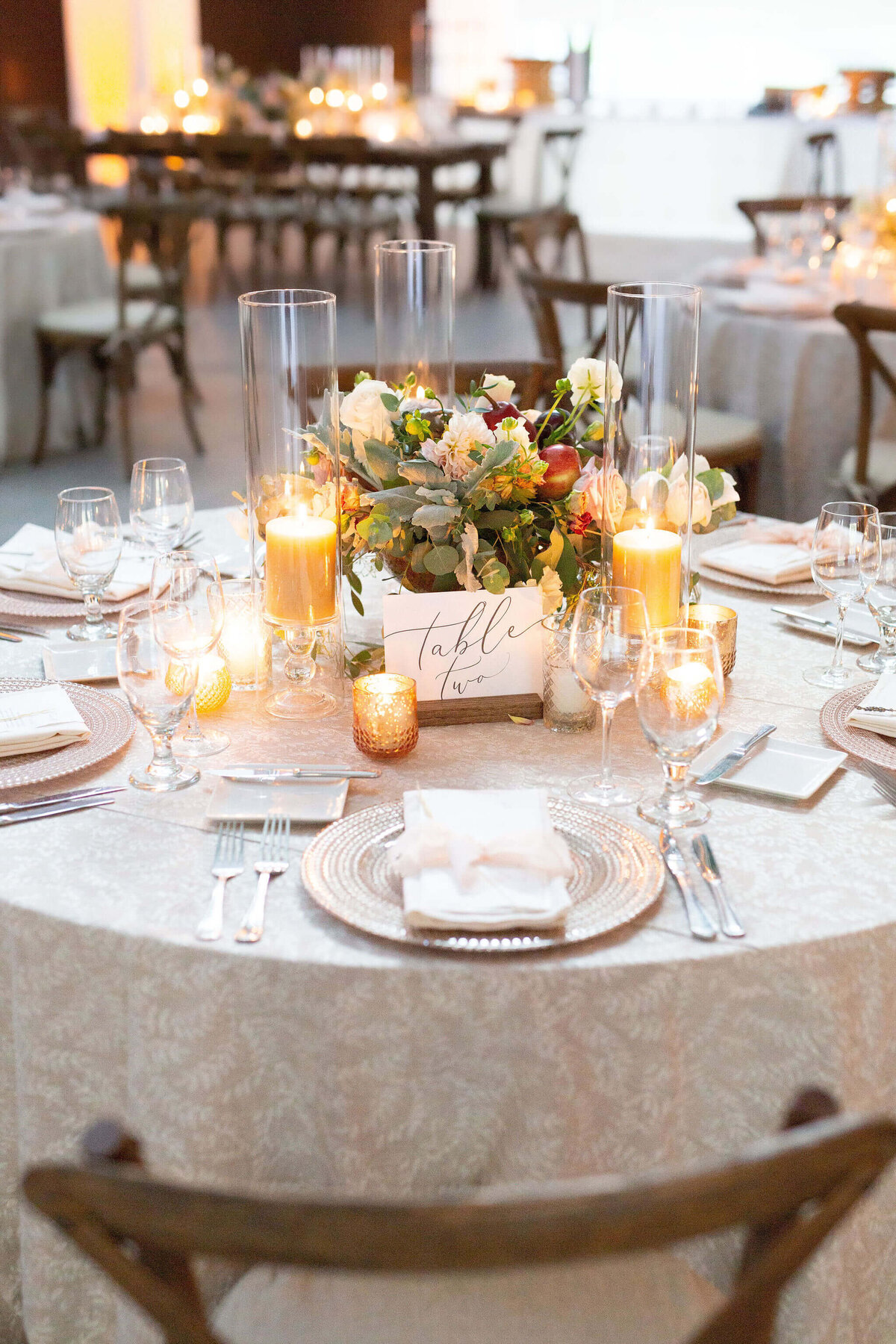 Dinner table set for a wedding with flowers and chargers