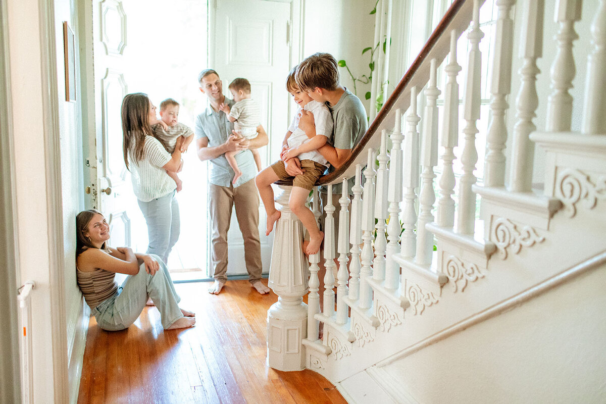 Beautifully composed family portrait on decorative stairs, taken by Sara James, a San Antonio family photographer.