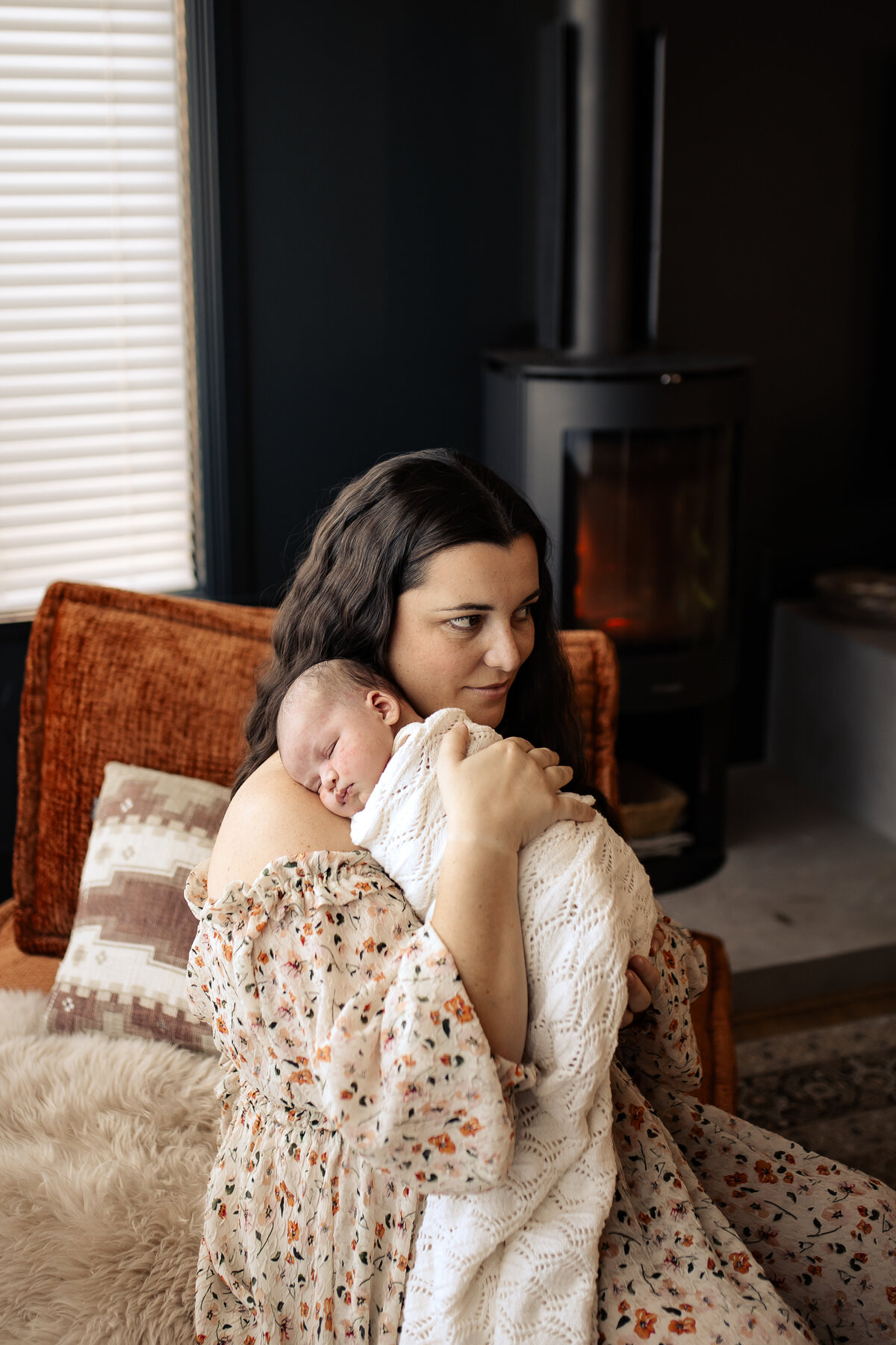 Newborn baby yawning peacefully in a cozy Hawke’s Bay home – heartwarming newborn photography by a local Hawke’s Bay photographer, capturing tender moments in Napier, Hastings, and Havelock North