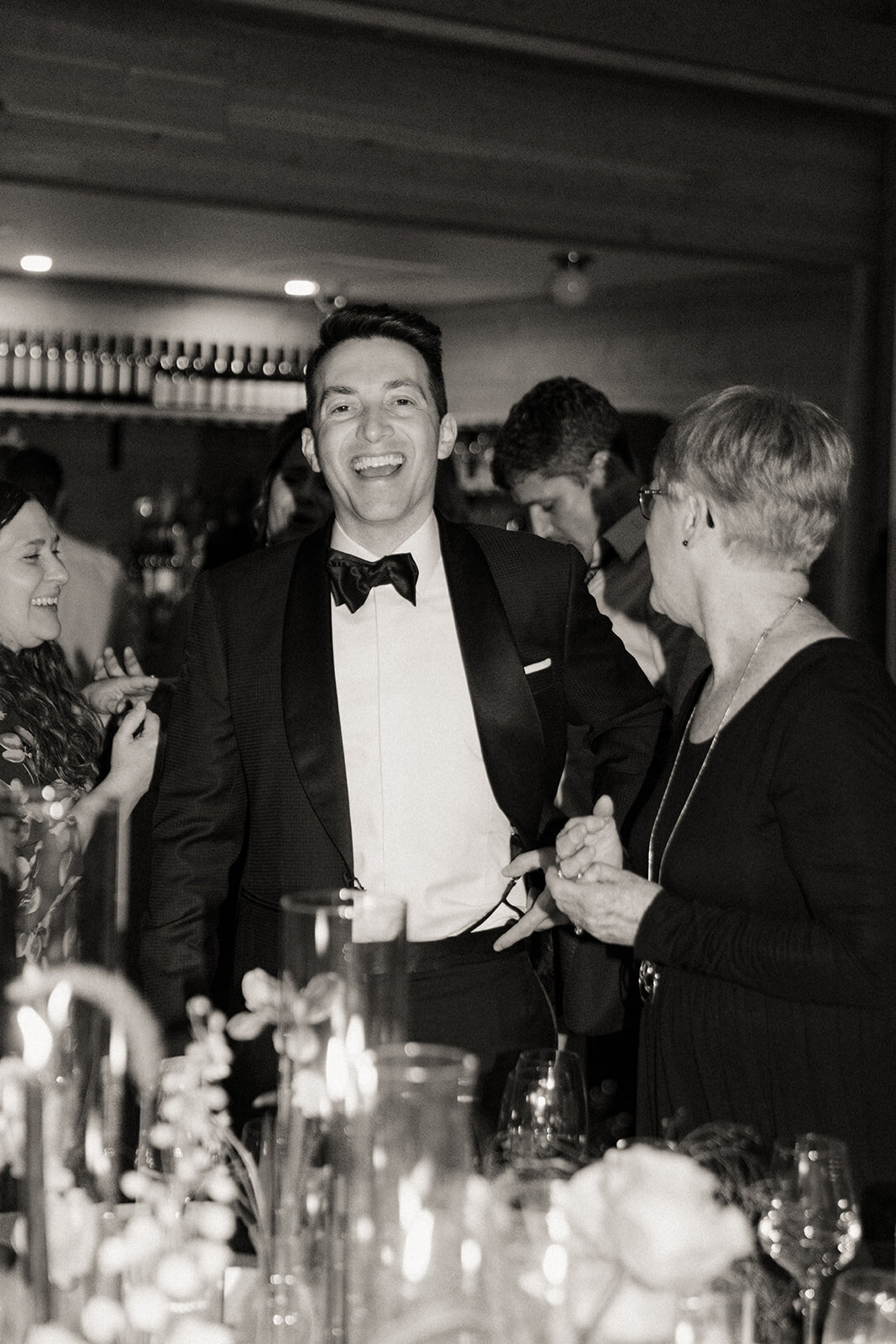 A candid of a groom at The Lake House on Canandaigua wedding reception