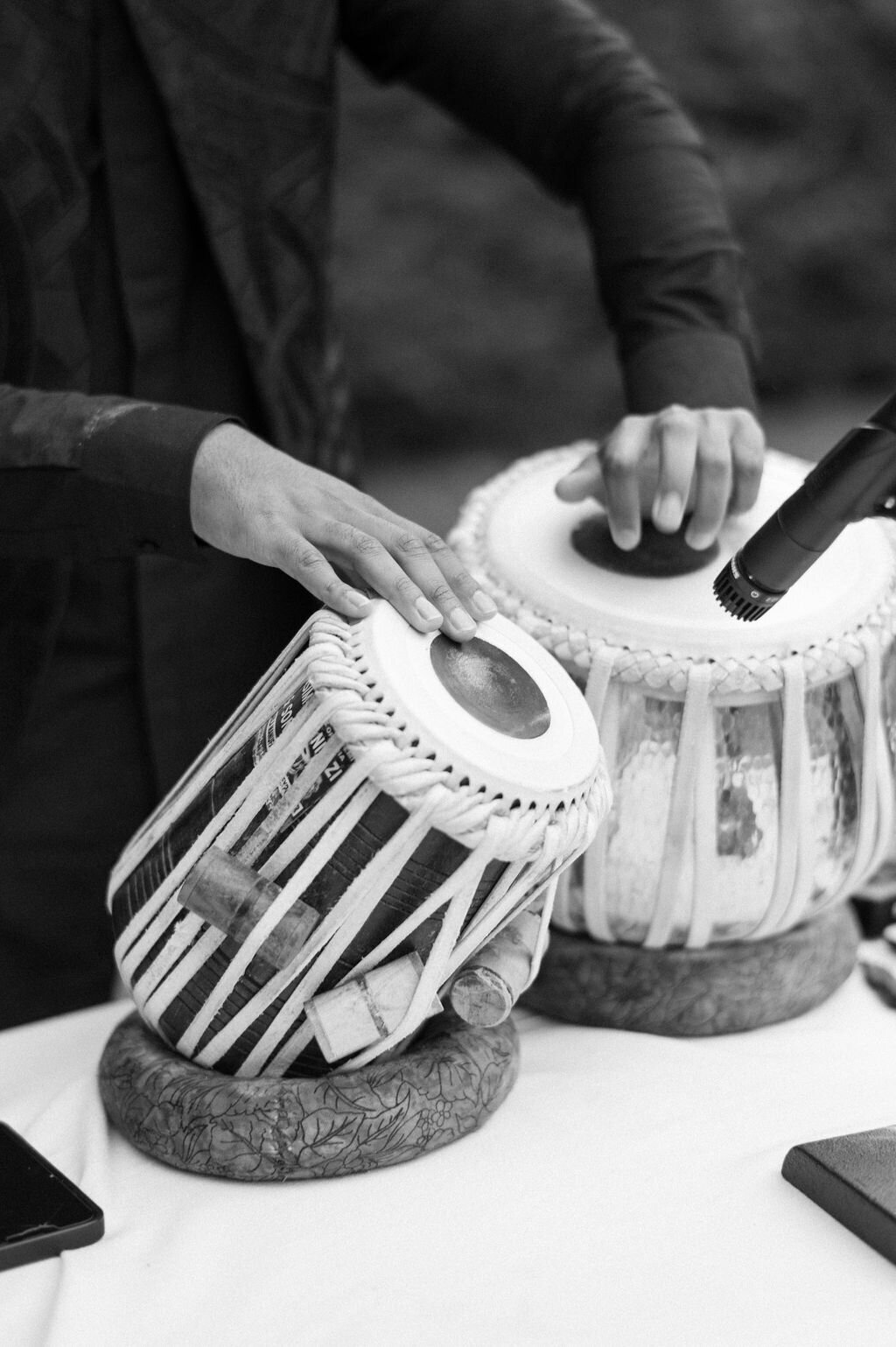 Close up of musician playing table drums at a luxury wedding ceremony in Highlands, NC. 