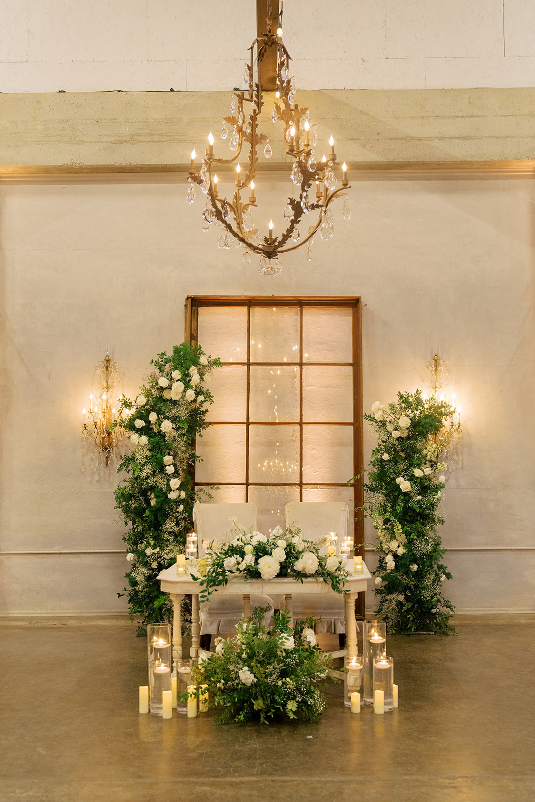 sweetheart table decor with flowers and candles