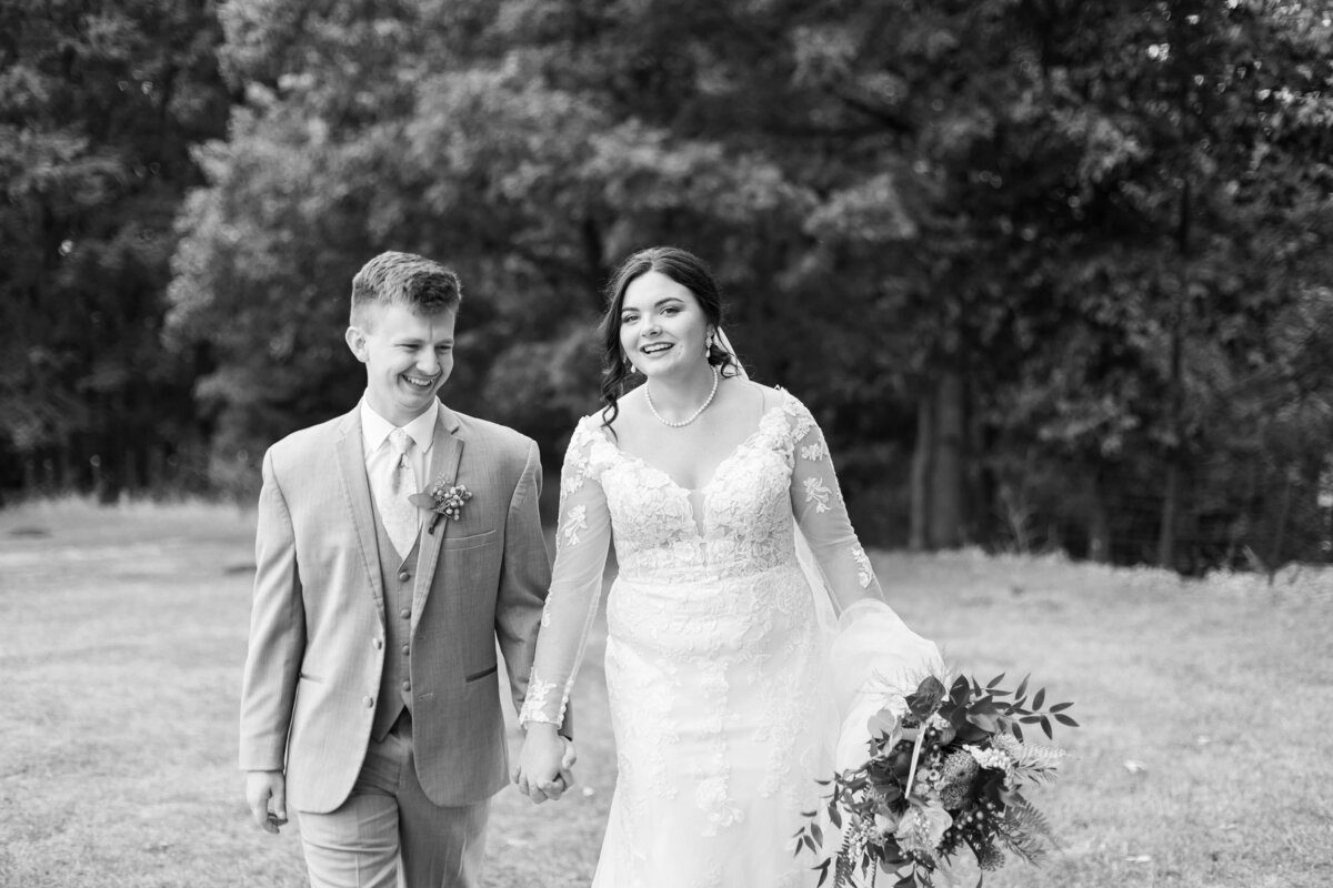 Bride and groom walking along at wedding at Mahr Park, Tennessee