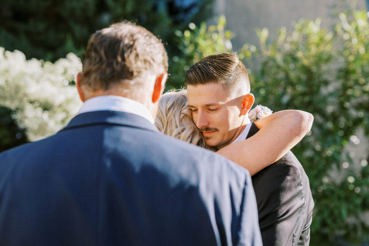 groom-hugging-mother