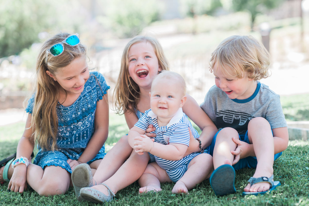 four kids laughing