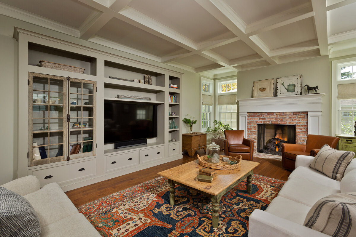 living room with shelves table and sitting area