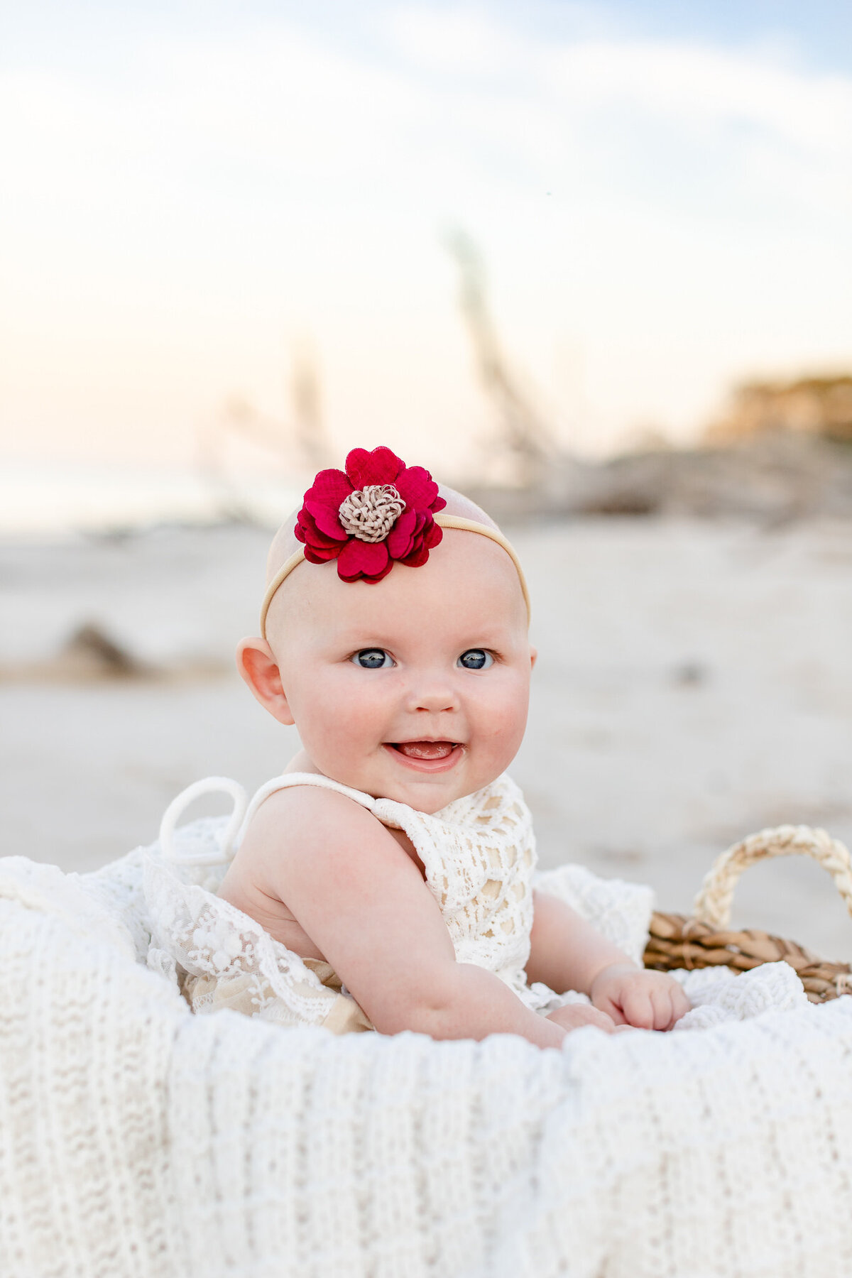 3 month old posing during family session on the beach