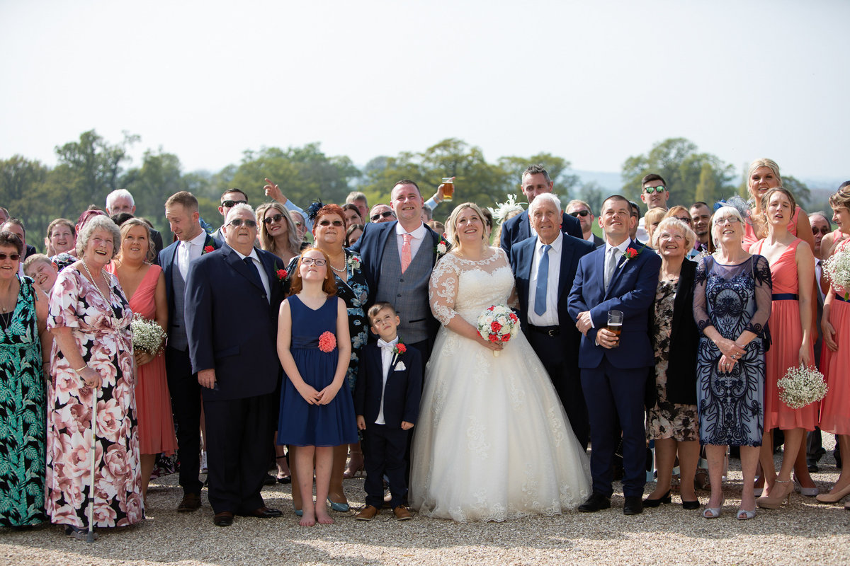 Outdoor wedding ceremony at Rockbeare Manor Devon group shot