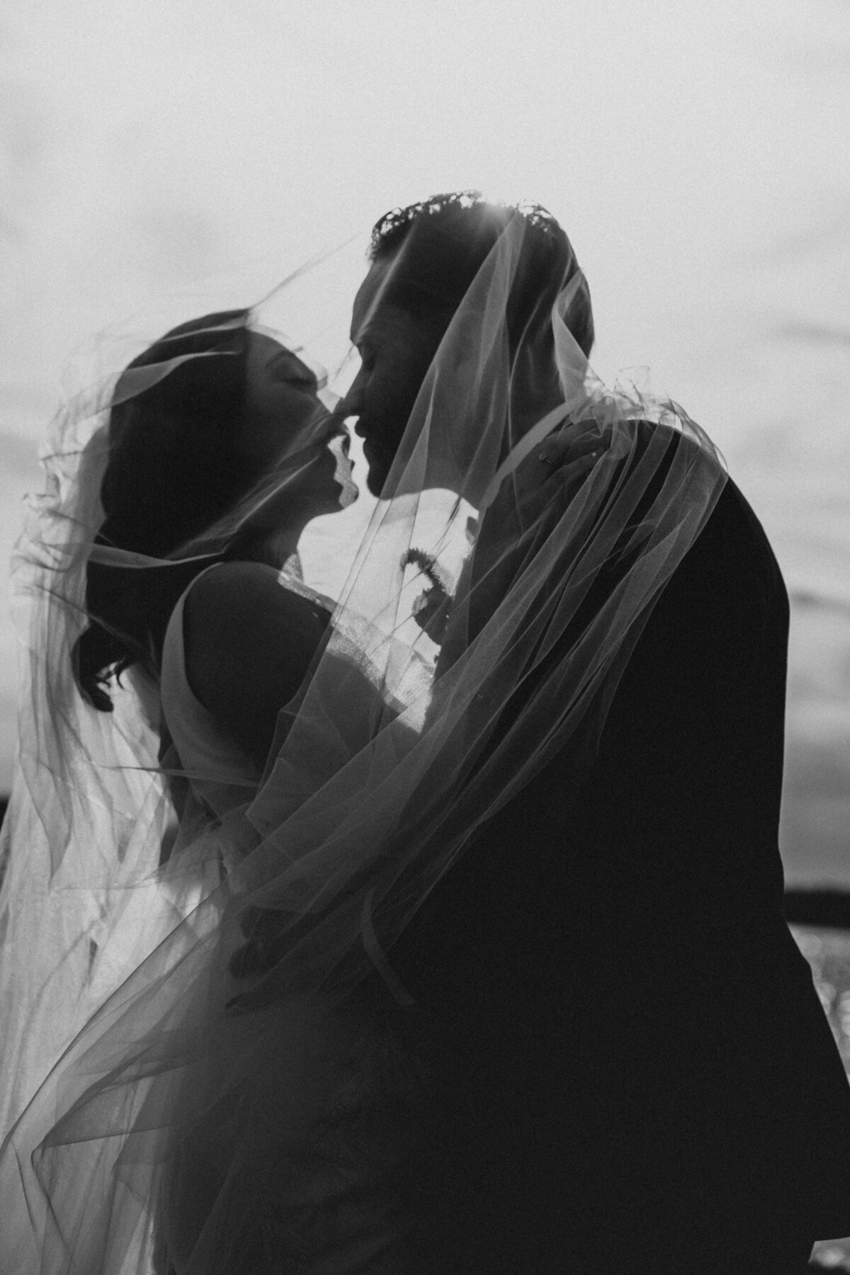 couple under a veil in a dramatic shot
