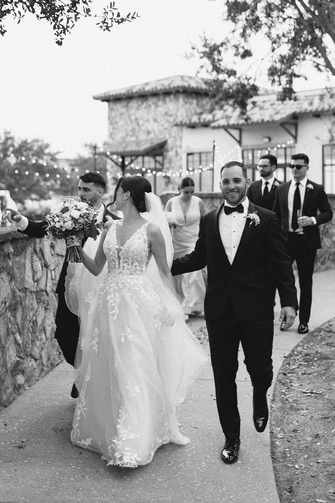 bridal party walking at bella collina orlando wedding​