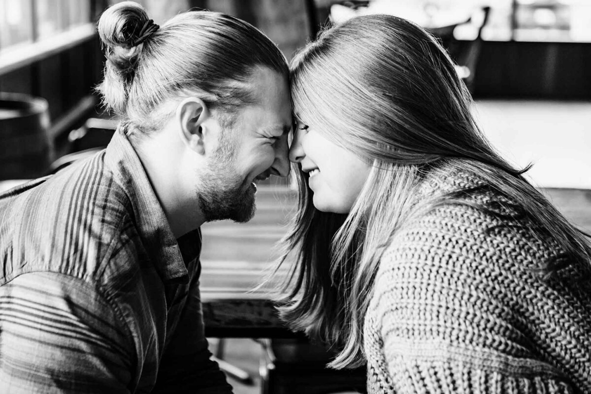 Missoula couple touching foreheads at Highlander Beer, Missoula