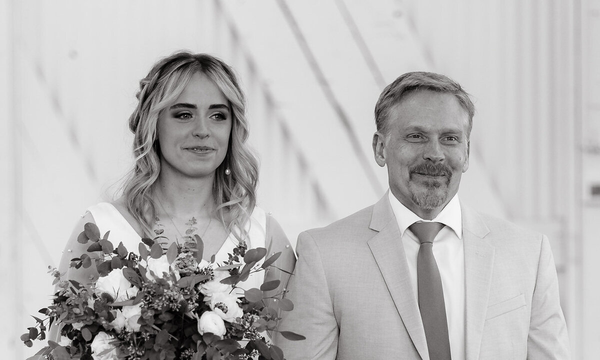 bride walking down aisle with dad