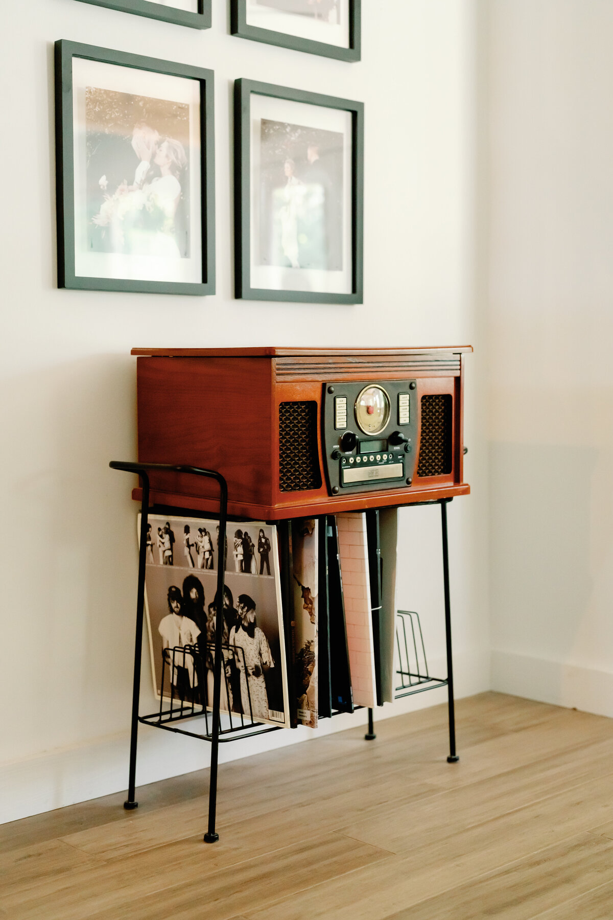 vintage record player under gallery wall